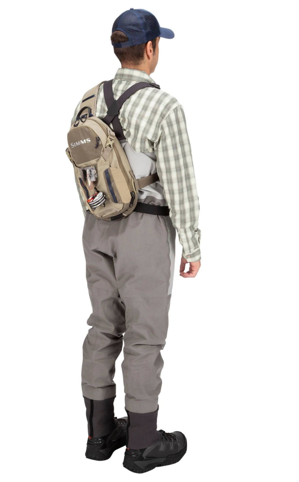 Simms Freestone Ambidextrous Tactical Sling Pack Tan Model Left Simms Freestone Ambidextrous Tactical Sling Pack Tan Model Left